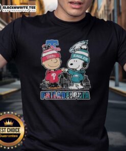 Adorable Philadelphia Phillies and Eagles 75th Anniversary Peanuts Snoopy T-shirt, perfect for sports fans and collectors.