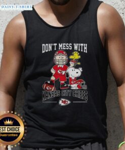 Alt Text: Cute Snoopy and Charlie Brown Peanuts tank top featuring Kansas City Chiefs football design for fans.