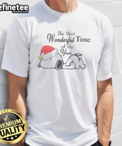Alt Text: Cute Snoopy Christmas Hat T-Shirt featuring The Most Wonderful Time Of The Year text, perfect for holiday cheer.