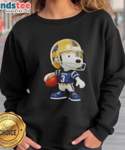 Cute Snoopy holding a ball and smiling at Notre Dame Fighting Irish fans in a vibrant sweatshirt.