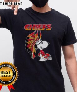 Cute Snoopy in war bonnets with Kansas City Chiefs football helmet on a stylish T-shirt design for fans.