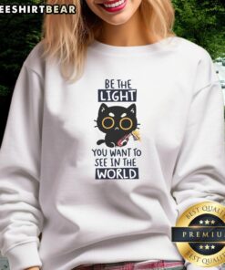 Funny cat sweatshirt with 'Be the light you want to see in the world' slogan, perfect for cat lovers and positivity enthusiasts.