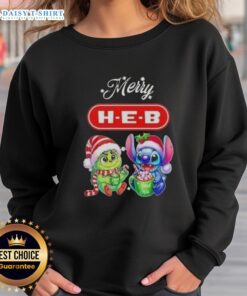 Alt Text: Funny Grinch and Stitch X H-E-B Merry Christmas sweatshirt, perfect for festive holiday celebrations and cozy winter wear.
