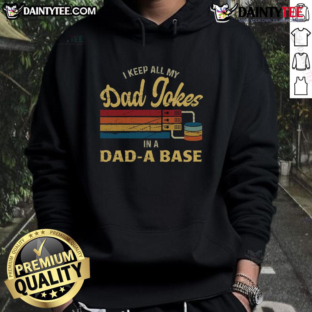 Funny I Keep A My Dad Jokes In A Dad A Base Hoodie Person wearing a 'Dad Jokes' hoodie, showcasing humor with a playful design, perfect for dad joke enthusiasts.