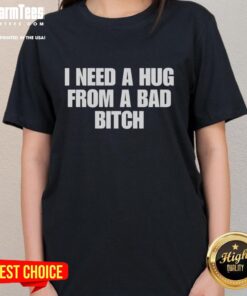 Funny 'I Need A Hug From A Bad Bitch' Ladies Tee in vibrant colors, perfect for casual wear and expressing humor.