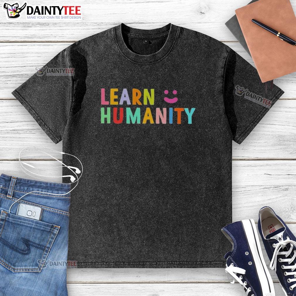 funny-learn-humanity-icon-smile-washed-t-shirt Funny learn humanity icon on a smiley face graphic printed on a washed t-shirt, perfect for casual wear.