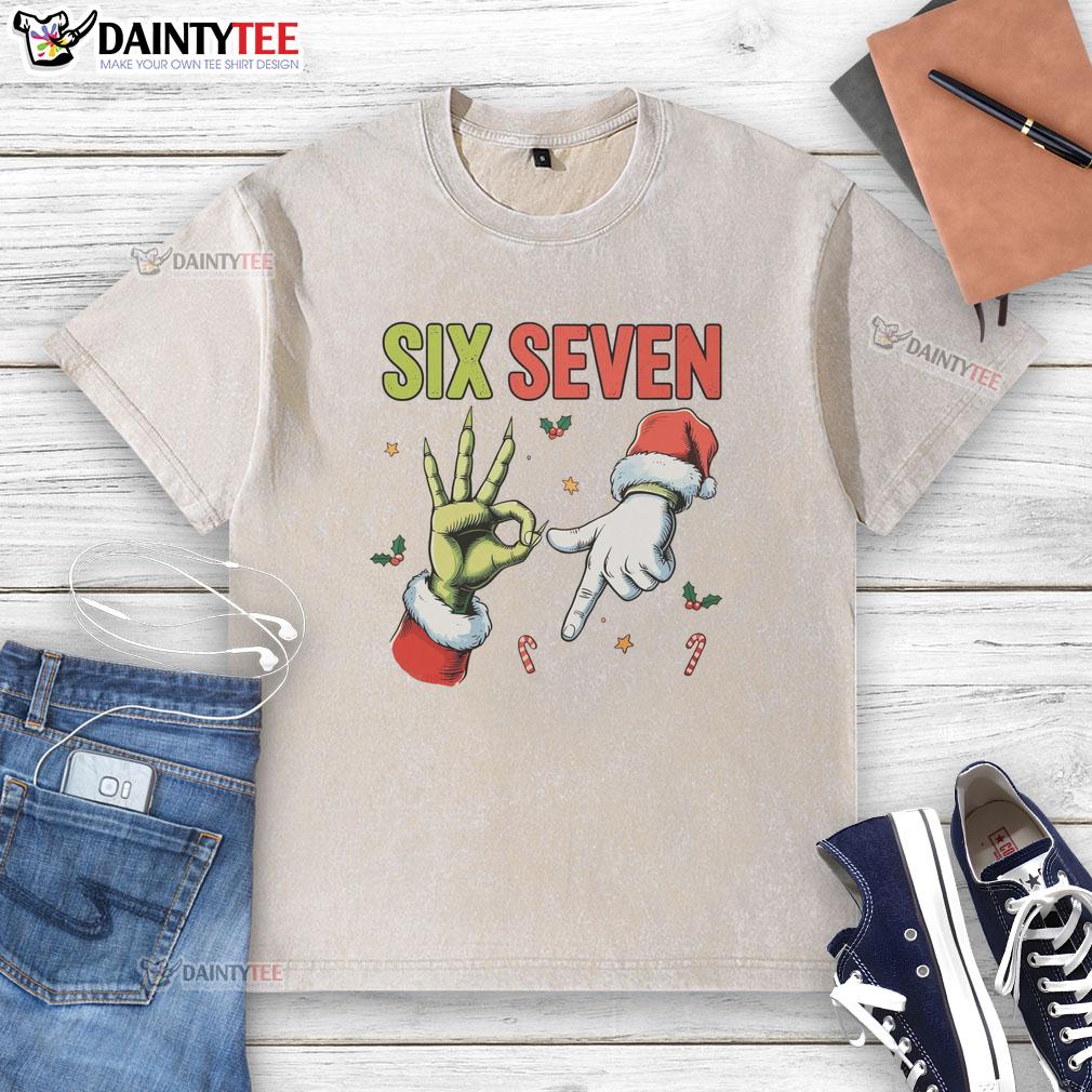 funny-six-seven-6-7-67-meme-christmas-xmas-washed-t-shirt Funny Christmas meme on a washed t-shirt featuring the numbers 6 and 7, perfect for holiday humor and festive vibes.