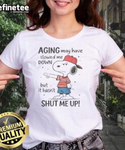 Funny Snoopy aging tee for ladies with playful quote: 'May have slowed me down, but hasnt shut me up.'