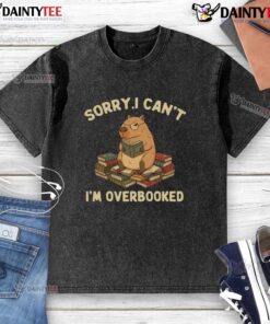 Funny 'Sorry I Can't, I'm Overbooked' capybara design on a washed t-shirt, perfect for casual, humorous style.