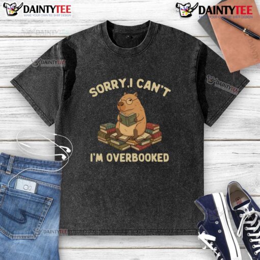 Funny 'Sorry I Can't, I'm Overbooked' capybara design on a washed t-shirt, perfect for casual, humorous style.