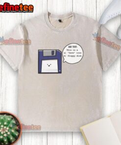 Funny vintage floppy disk graphic on a washed t-shirt, perfect for nostalgia lovers and tech enthusiasts.
