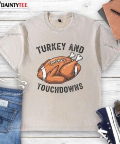 Alt Text: Funny turkey and touchdowns Thanksgiving football fan washed t-shirt perfect for holiday celebrations and game day.