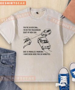 Funny 'Youre in her DMs, Im in the passenger seat' washed t-shirt design featuring humorous parallel parking theme.