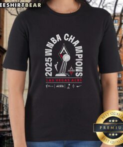 2025 WNBA Champions Las Vegas Aces trophy on display with ladies' tee featuring team logo and celebration design.