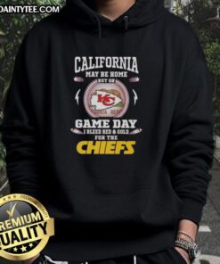 Person wearing a 'Good California Is Home But On Game Day My Heart Belongs To The Kansas City Chiefs' hoodie outdoors.