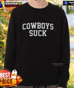 Fan at Good Chiefs vs Lions game wearing 'Cowboys Suck' sweatshirt, showcasing team spirit and sports enthusiasm.