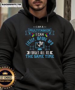 Alt Text: Person wearing 'I'm a multitasker' hoodie, showcasing humor in multitasking with a computer in the background.