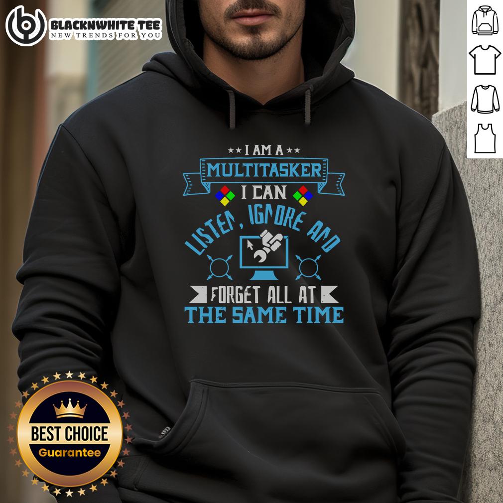 Alt Text: Person wearing 'I'm a multitasker' hoodie, showcasing humor in multitasking with a computer in the background.