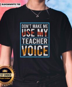 Good Don't Make Me Use My Teacher Voice Ladies Tee featuring a playful graphic design on a stylish women's shirt.
