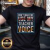 Good Don't Make Me Use My Teacher Voice T-Shirt featuring playful typography and teacher-themed design for educators.