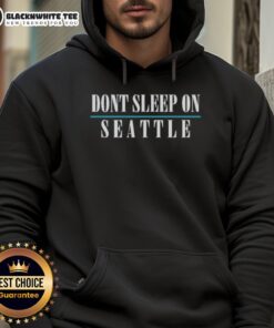 Cozy 'Good Don't Sleep On Seattle' hoodie displayed on a hanger, showcasing its trendy design and vibrant colors.