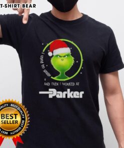Good Grinch Christmas t-shirt featuring a humorous quote about working at Parker Hannifin with festive graphics.