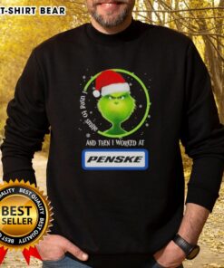 Alt Text: Good Grinch Christmas sweatshirt featuring 'I Used to Smile, Then I Worked at Penske Corporation' design.