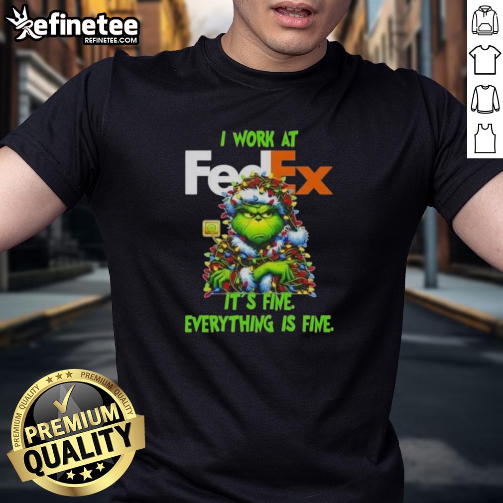 good-grinch-christmas-tree-x-fedex-i-work-at-its-fine-everything-is-fine-t-shirt-1 Alt Text: Good Grinch Christmas Tree t-shirt featuring 'I Work At It's Fine Everything Is Fine' design for festive holiday cheer.