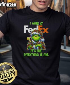 Alt Text: Good Grinch Christmas Tree t-shirt featuring 'I Work At It's Fine Everything Is Fine' design for festive holiday cheer.