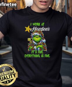Alt Text: Good Grinch Christmas Tree X Hardee's T-Shirt: 'I Work At It's Fine Everything Is Fine' festive design.