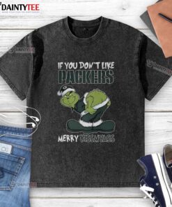 Good Grinch X Green Bay Packers 'Merry Kiss My Ass' 2025 Christmas washed t-shirt featuring festive design and vibrant colors.