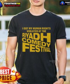 Alt Text: T-shirt featuring 'Good I Got My Human Rights Violated At The Riyadh Comedy Festival' slogan, highlighting human rights issues.