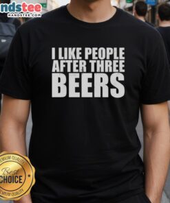 Person wearing a 'Good I Like People After Three Beers' T-shirt at a casual gathering, showcasing fun and humor.