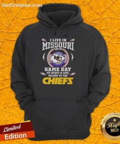 Woman wearing a Kansas City Chiefs hoodie, proudly showcasing her game day spirit in Missouri.