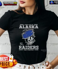 Alaska resident wearing a Raiders fan tee, showcasing pride for the team with a stylish ladies' fit shirt design.