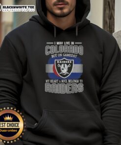 Person wearing a Raiders hoodie, showing team spirit on game day, despite living in Colorado.