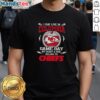 Fan wearing 'Good I May Live In DC But My Heart Belongs To Kansas City Chiefs' T-Shirt on Game Day, showcasing team spirit.