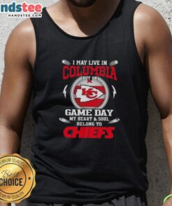 Fan wearing a Kansas City Chiefs tank top, showcasing team spirit on game day in the District of Columbia.