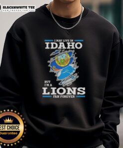 Idaho resident wearing 'Good I May Live In Idaho But I'm A Lions Fan Forever' sweatshirt, showcasing team spirit.