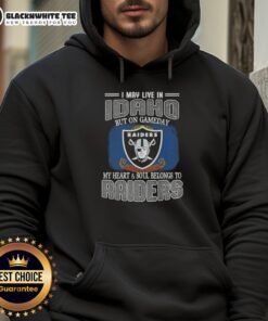 Fan wearing a Raiders hoodie proudly in Idaho, showcasing team spirit on game day.