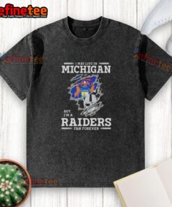 Good I May Live In Michigan But I'm A Raiders Fan Forever washed t-shirt, showcasing team pride and casual style.