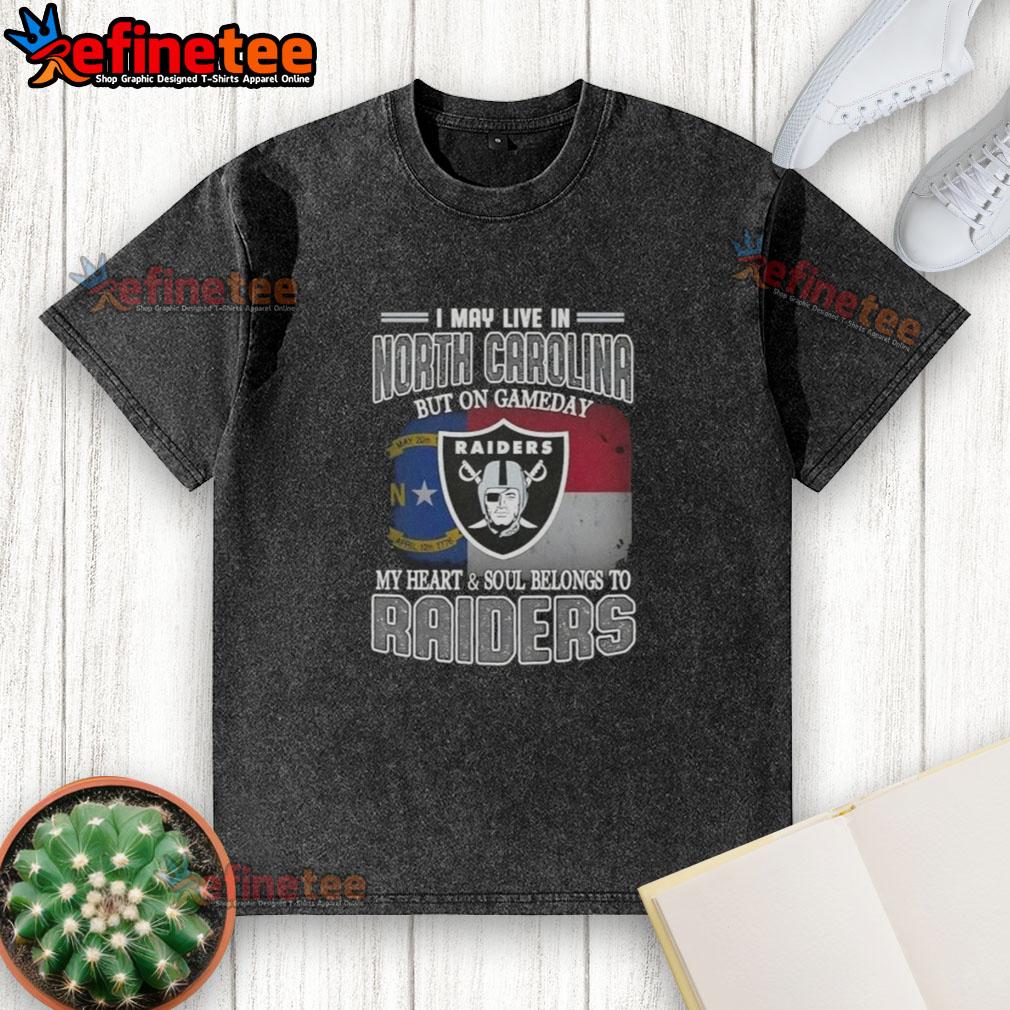 good-i-may-live-in-north-carolina-but-on-gameday-my-heart-and-soul-belongs-to-raiders-washed-t-shirt Good I May Live in North Carolina But On Gameday My Heart and Soul Belongs to Raiders washed t-shirt displayed on a hanger.