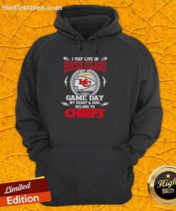 Fan wearing a Kansas City Chiefs hoodie, showcasing team spirit while living in Rhode Island on game day.