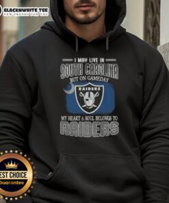 Alt Text: Person wearing a Raiders hoodie, showing team spirit in South Carolina on game day.