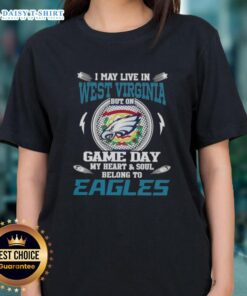 Stylish ladies tee featuring 'Good I May Live In West Virginia But On Game Day My Heart Belongs To Philadelphia Eagles' design.