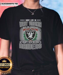 Alt Text: Womens tee featuring 'Good, I May Live in West Virginia, But On Gameday My Heart Belongs to Raiders' design.