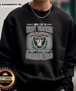 Cozy sweatshirt featuring 'Good I May Live In West Virginia But On Gameday My Heart And Soul Belongs To Raiders' design.