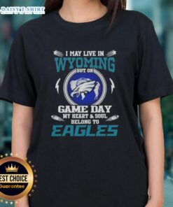 Alt Text: Ladies tee featuring 'Good I May Live In Wyoming But On Game Day My Heart Belongs To Philadelphia Eagles' design.