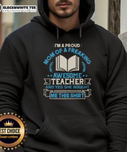 Alt Text: Proud mom wearing a hoodie that says I'm a Proud Mom of a Freaking Awesome Teacher showcasing her support.
