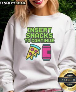 Cozy sweatshirt featuring 'Good Insert Snacks to Continue' graphic, perfect for snack lovers and casual wear.